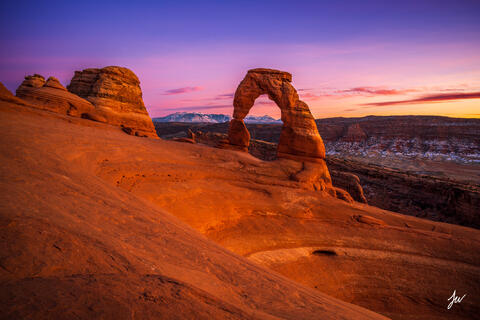 Sunset over Delicate Arch in Arches National Park near Moab, Utah.