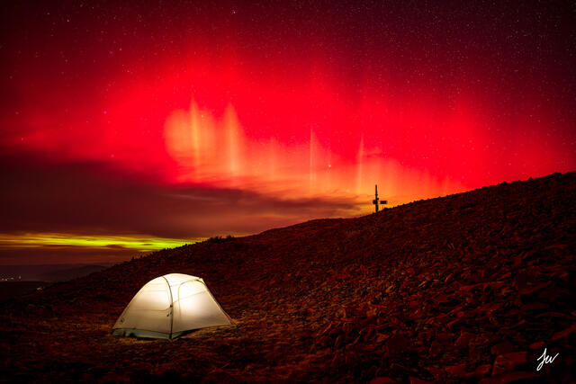 Aurora Borealis over Aspen Highlands with tent. 