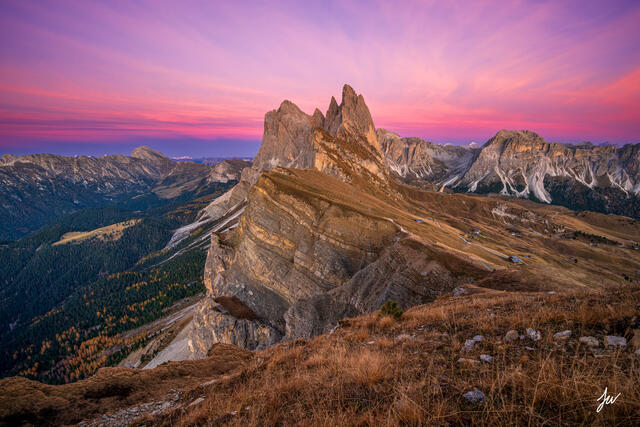 Sunset over Seceda in the Dolomites of northern Italy, with dramatic ridgelines glowing in warm alpine light.