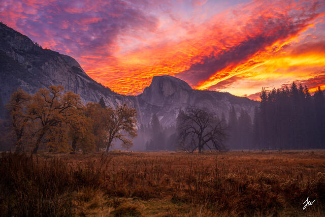 Half Dome rises above Cook's Meadow in Yosemite Valley in autumn.