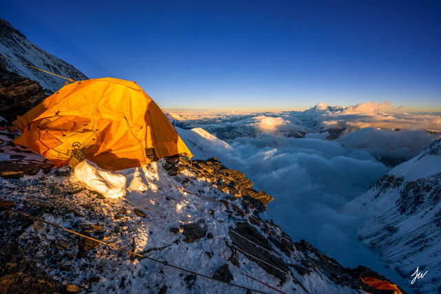Mount Everest Camp 2 tents positioned on a dramatic cliffside during a high-altitude climbing expedition.