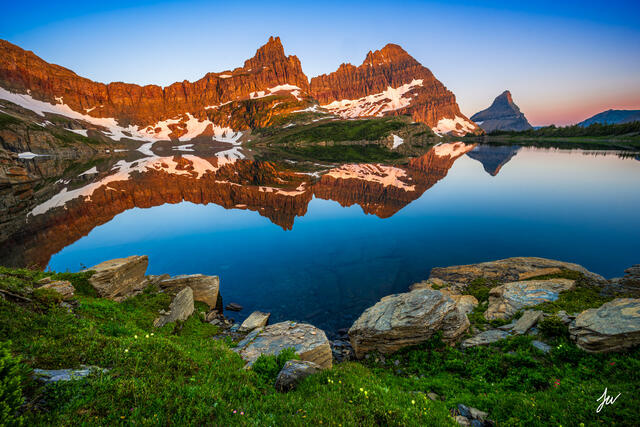 Alpine lake reflection in Glacier National Park.
