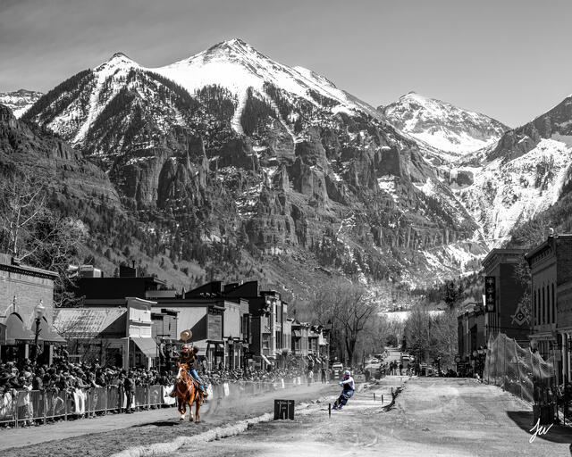Skier being pulled by a horse during skijoring in Telluride, Colorado.