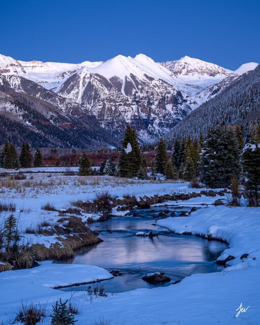 A snowy winter scene in Telluride, Colorado with mountains and alpine landscape.