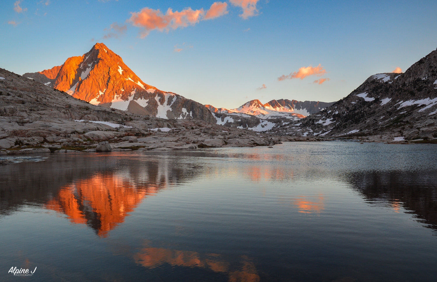 A reflection of an alpine lake in the Sierra Nevada Mountains in California.