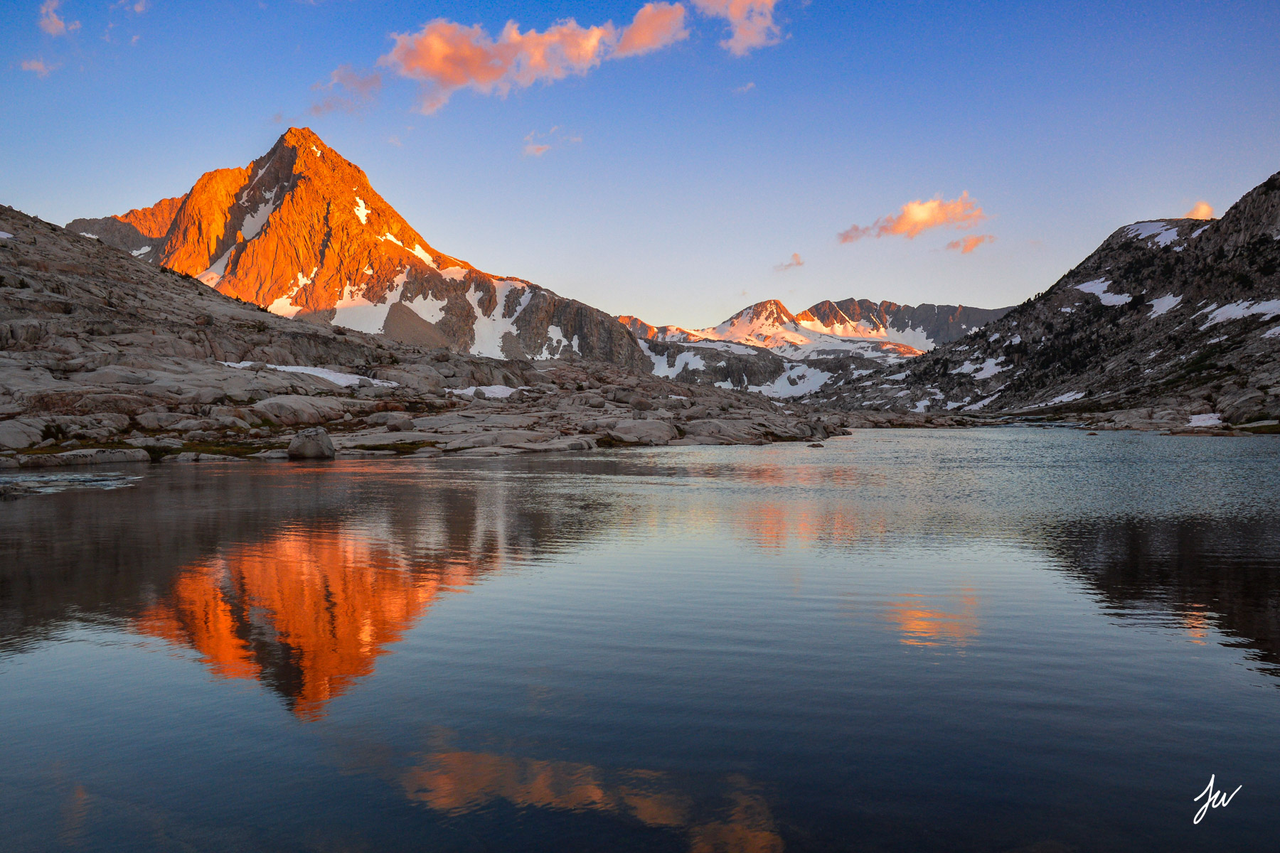 A reflection of an alpine lake in the Sierra Nevada Mountains in California.