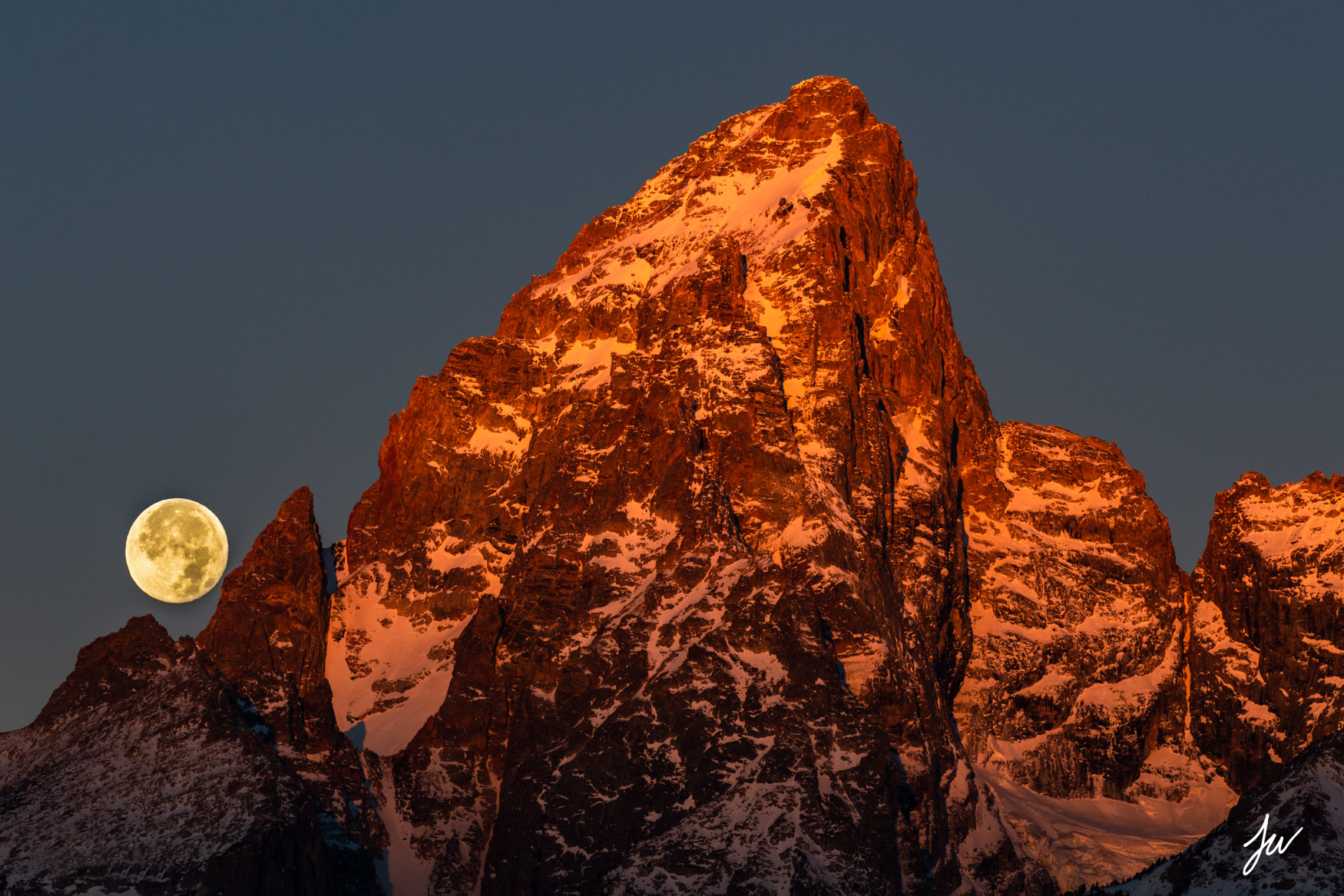 Sunrise and moonset on Grand Teton in Wyoming. 