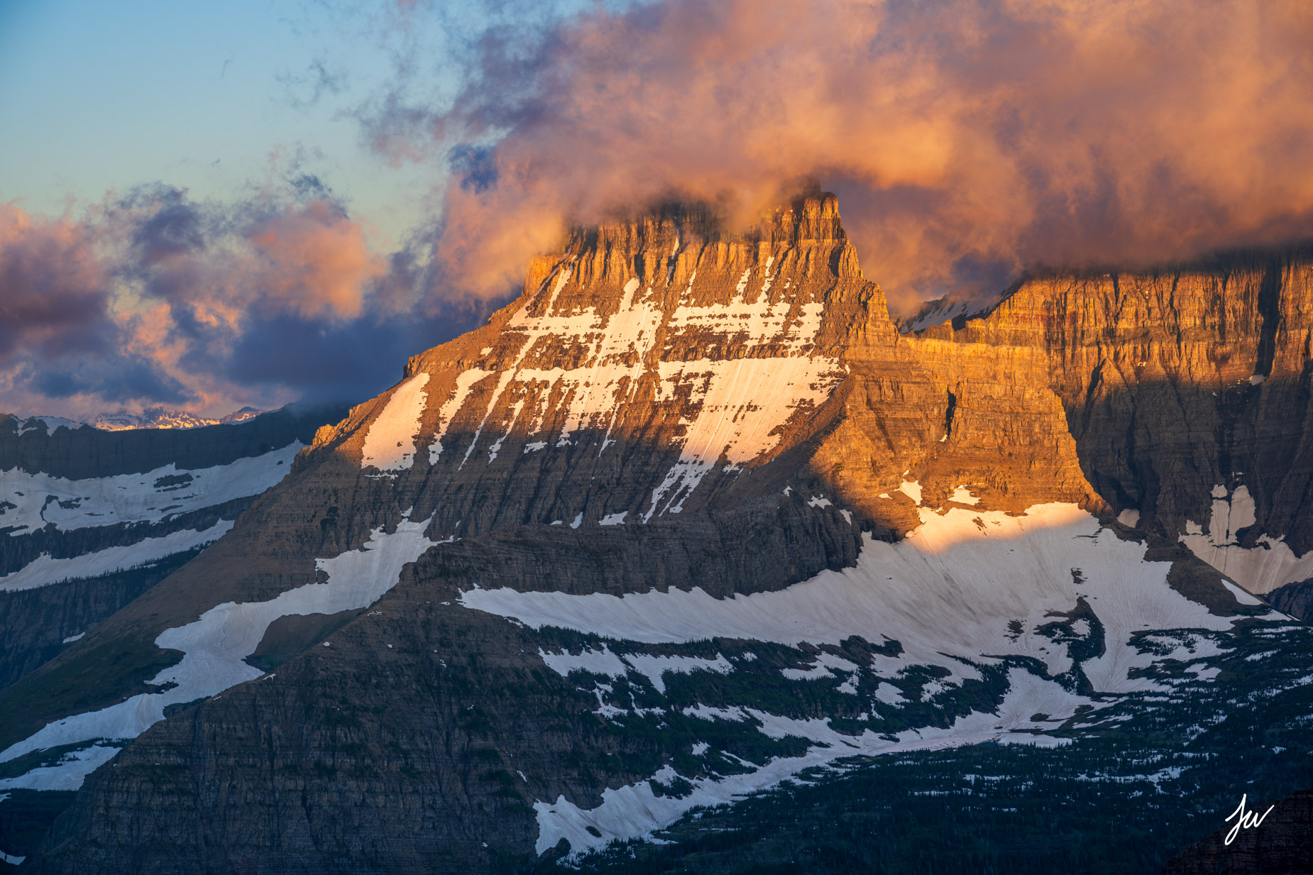 Heavy Shield Sunrise light on Mount Wilbur in Many Glacier.