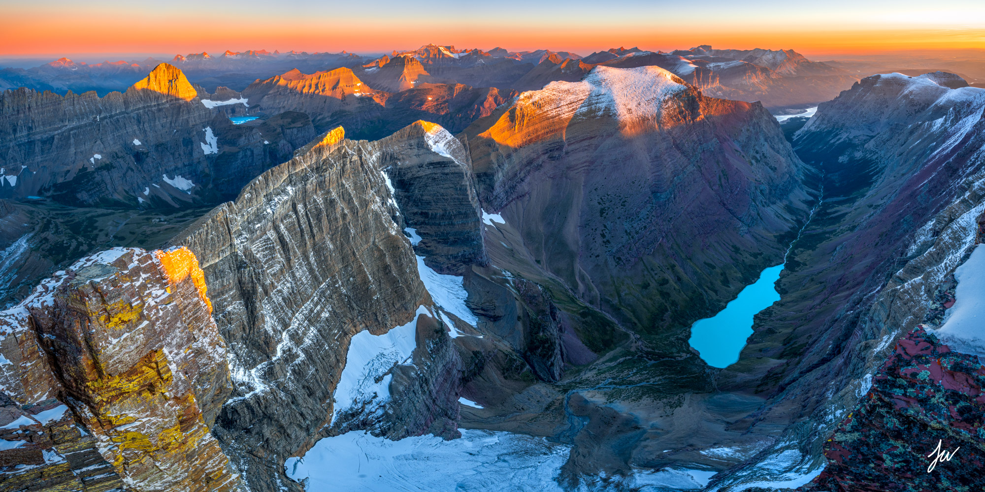 Sunrise panorama from summit of Mt Siyeh in Glacier Park.