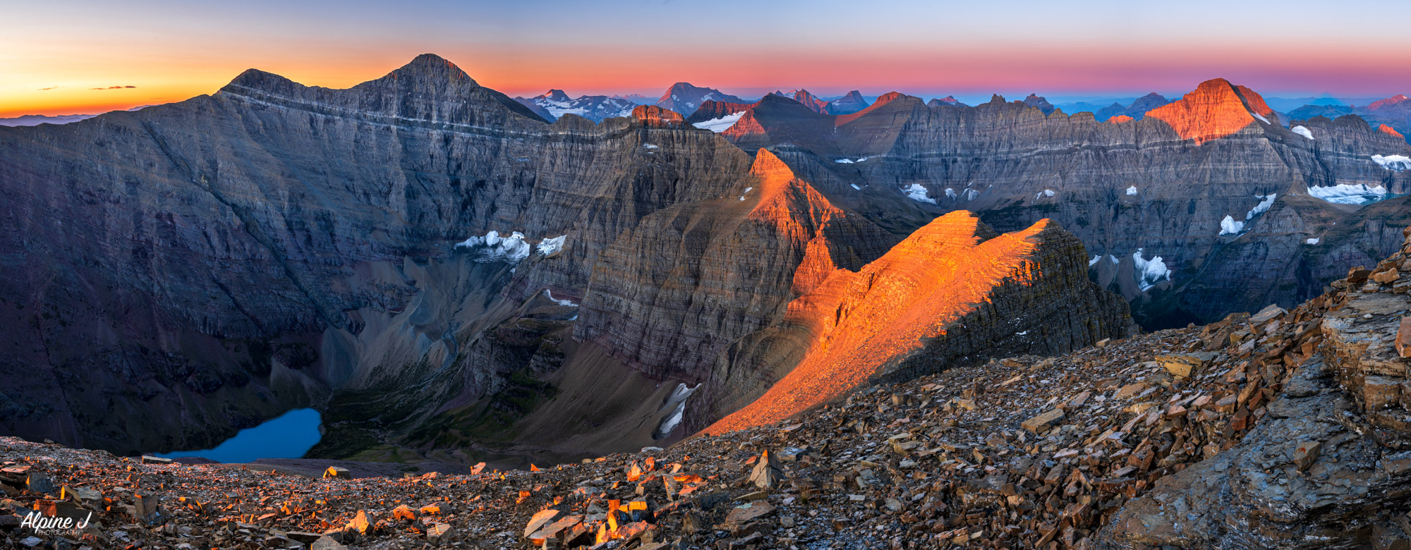 Sunrise from a mountain top over Glacier National Park, Montana. 