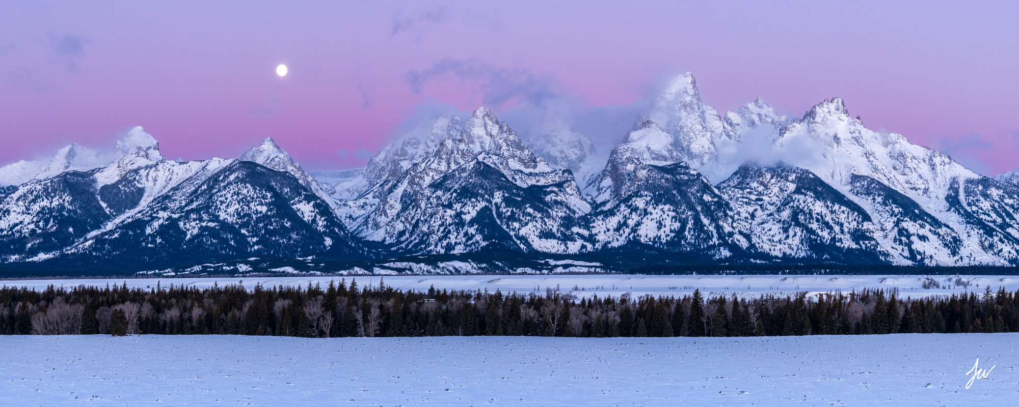 Dawn over the Teton Range in winter in Grand Teton National Park.