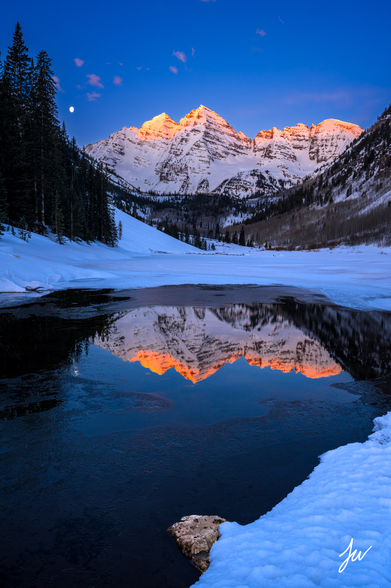 First light on the Maroon Bells in Winter.
